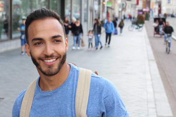 istock Cute ethnic bearded man smiling outdoors 1166265235