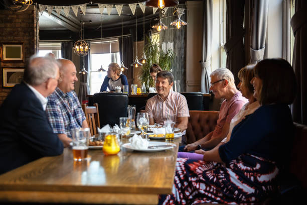 istock Cheerful Friends Enjoying Lunch in Sunny Pub 1166265953