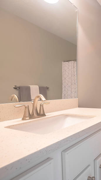 istock Vertical Home bathroom interior with dark gray tile floor and light gray wall 1166266864
