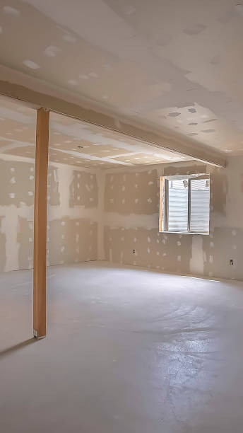 istock Vertical Room interior under construction with unfinished wall ceiling and floor 1166267411
