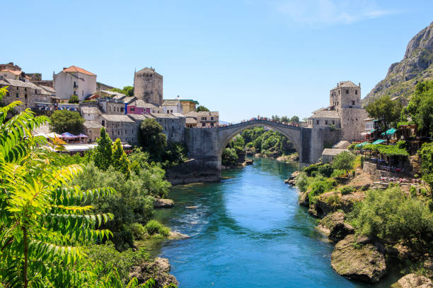 The Old Bridge in Mostar Mostar, Bosnia and Herzegovina - July 11, 2019: The Old Bridge in Mostar with emerald river Neretva. stari most mostar stock pictures, royalty-free photos & images