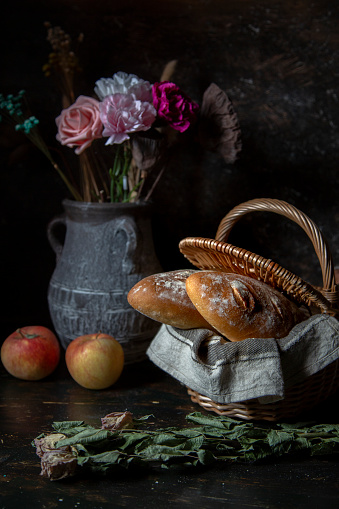 still life:homemade wholegrain bread in basket on table
