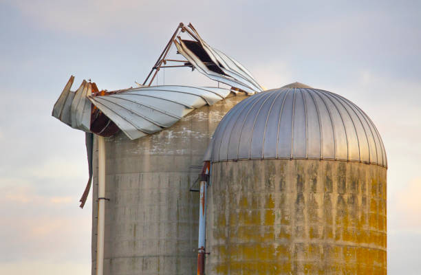istock Old farm silos damaged by wind storm. 1166270501