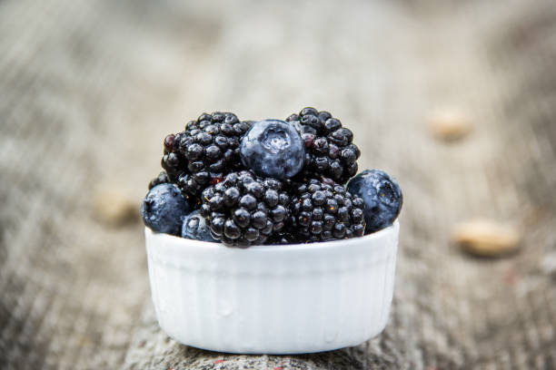 istock Delicious Fresh Juicy Berries. Blueberries and blackberries 1166270907