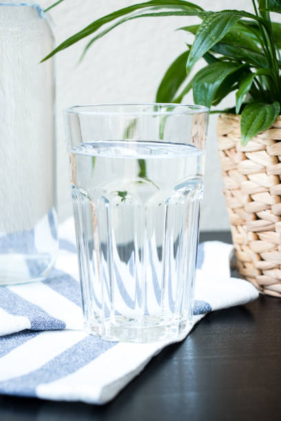 istock A glass of water with a blurred background. Top view. 1166271097