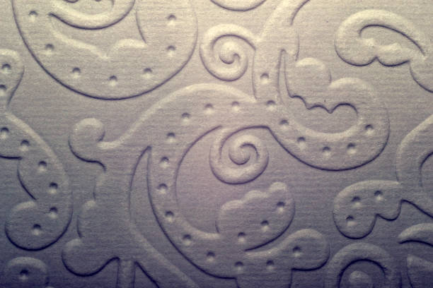 Perforated paper. Flat brown cardboard background texture with perforated lines.