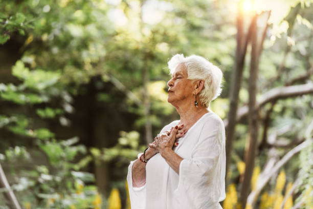 istock 84 years old senior woman doing tai chi 1166272234