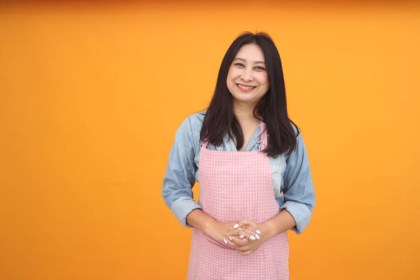 istock Happy Asian woman is cooking 1166272449