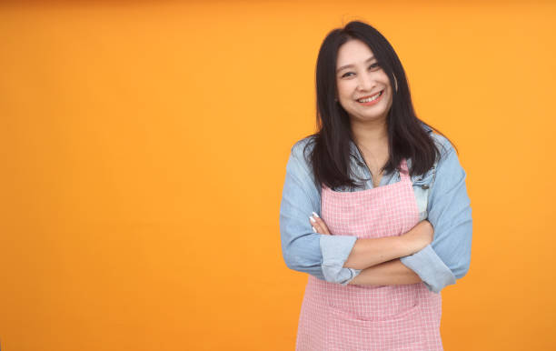 istock Happy Asian woman is cooking 1166272515