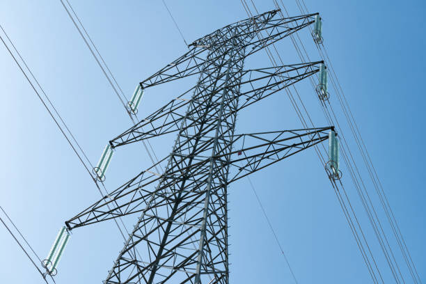 istock Overhead electrical power lines on a transmission tower. 1166273216