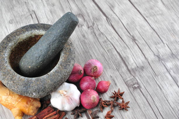 istock Mortar, star anise, cinnamon, ginger on a wooden background 1166273448