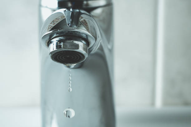 istock water drop dripping from the tap 1166277038