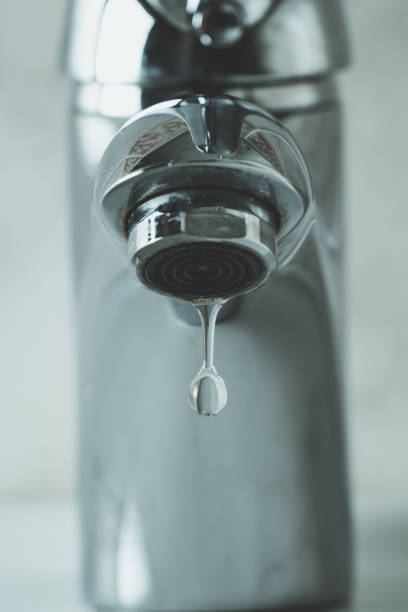 istock water drop dripping from the tap 1166277134