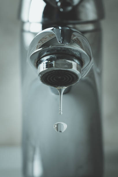 istock water drop dripping from the tap 1166277303