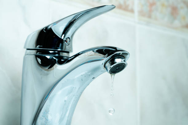 istock water drop dripping from the tap 1166277316