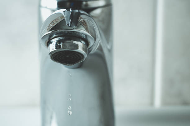 istock water drop dripping from the tap 1166277485