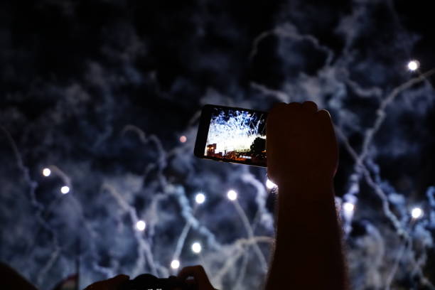 istock Filming fireworks with smartphone 1166277940