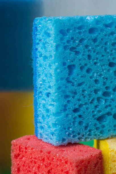 istock Stack geometric blocks construction abstract sponges in red, yellow, blue colors, reflection mirror background, macro 1166283820