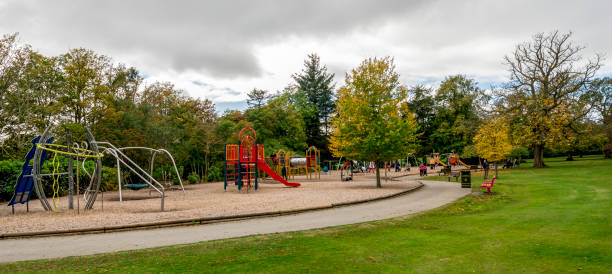 Hazlehead park view and a large children playground area with slides, bars, swings and other play equipment, Aberdeen, Scotland stock photo