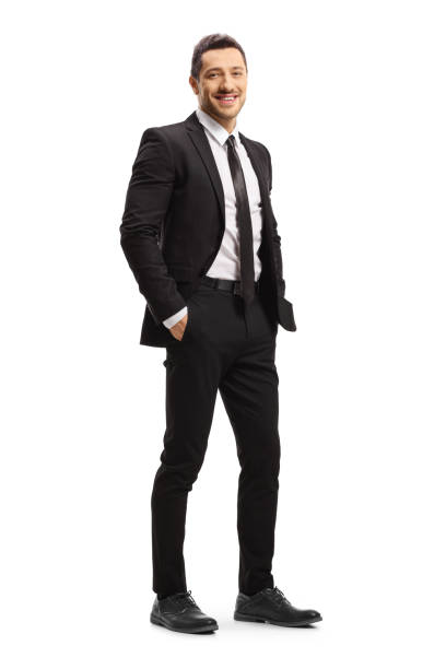 young man in a black suit posing - necktie isolated clothing white imagens e fotografias de stock