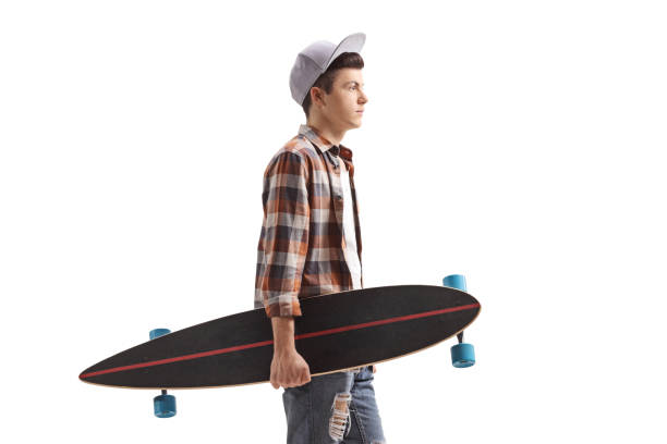 istock Male teenager with a longboard standing 1166285128