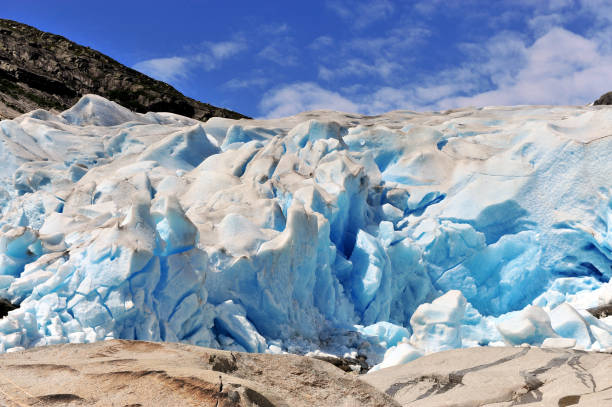 istock Amazing blue ice of Nigardsbreen glacier, Norway 1166286243