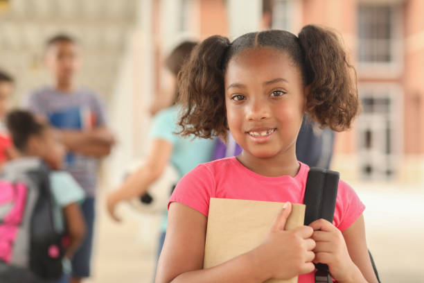 istock African descent, elementary age girl on school campus. 1166286269