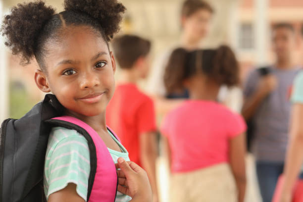 istock African descent, elementary age girl on school campus. 1166286288