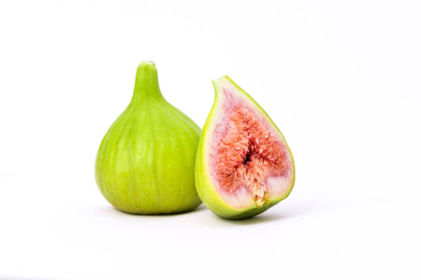 Green figs isolated on a white background stock photo