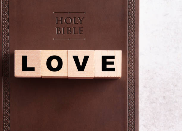 istock Love Spelled in Blocks on a Brown Leather Holy Bible 1166287526