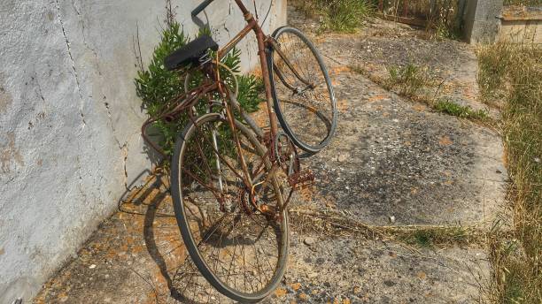 istock Rusty vintage bicycle on rustic ground. Retro 50's bike. 1166290113