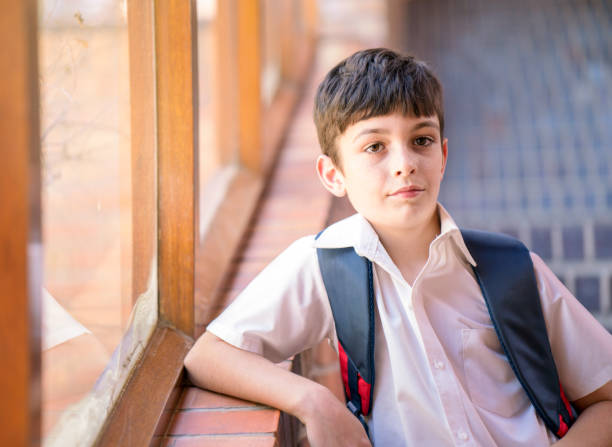 istock Portrait of smiling schoolboy with backpack 1166291047