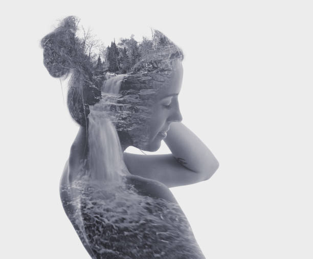 istock Multiple Exposure of young woman, river and waterfall 1166291338