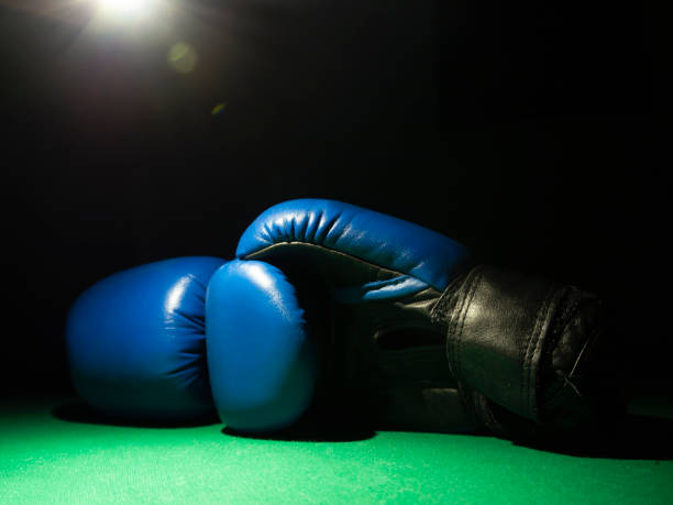istock Boxing gloves on the black background 1166292919