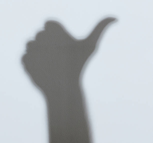 istock Shadow of hand with thumb up 1166293603