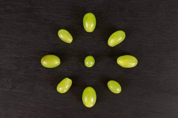 fresh green grape on grey stone - luminant imagens e fotografias de stock