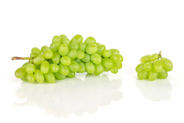 fresh green grape isolated on white - luminant imagens e fotografias de stock