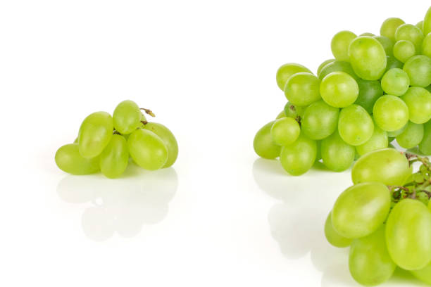 fresh green grape isolated on white - luminant imagens e fotografias de stock