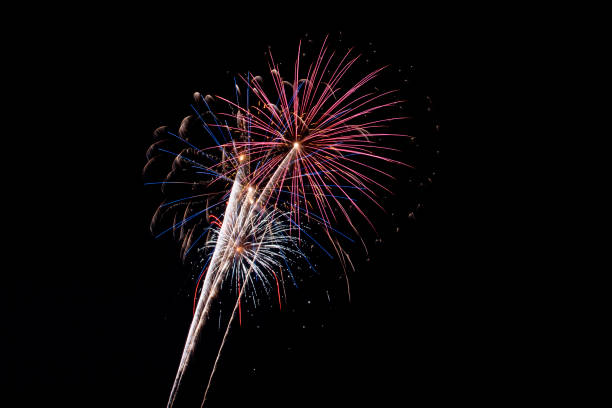 istock Beautiful fireworks display lights up the night time sky 1166298389