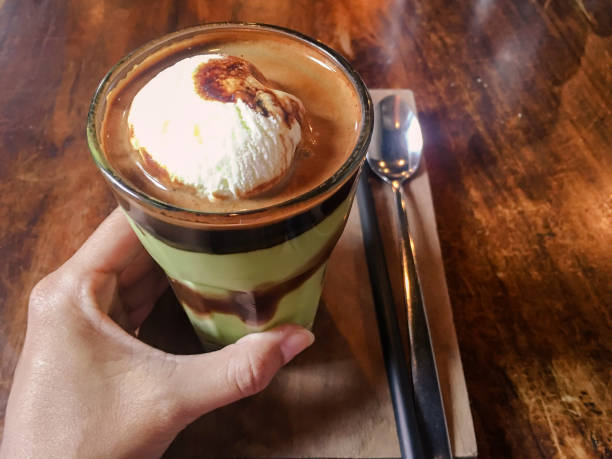 Young Asian women drinking avocado coffee float