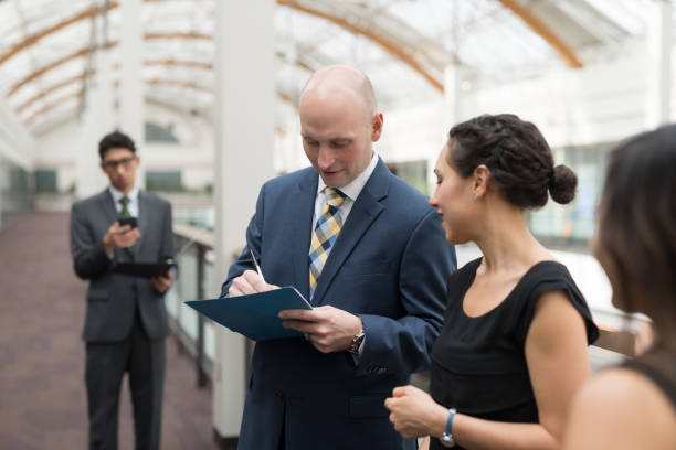 istock Business colleagues go over notes before their conference presentation 1166299089