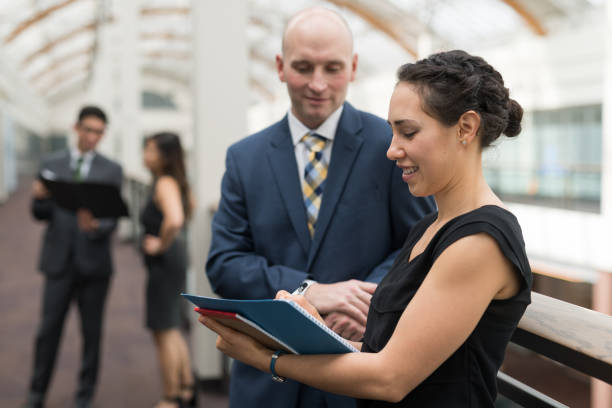 istock Business colleagues go over notes before their conference presentation 1166299097