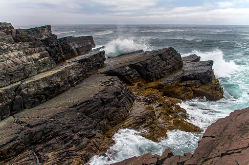 rock layers and heavy surf at Mistaken Point, Newfoundland