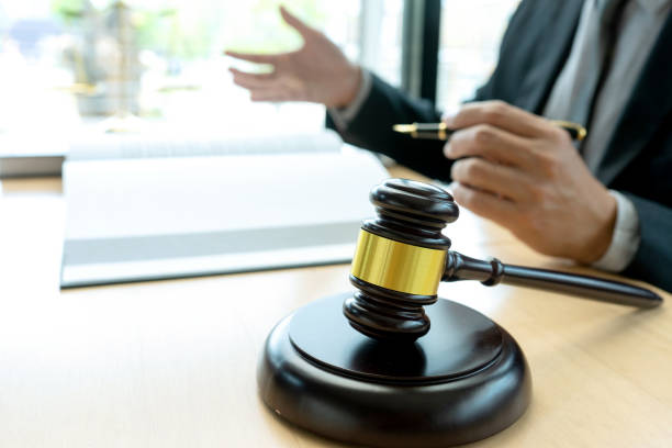 istock Judge or lawyer talking  with team 1166304692