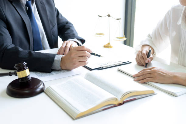 istock Judge or lawyer talking  with team 1166304749