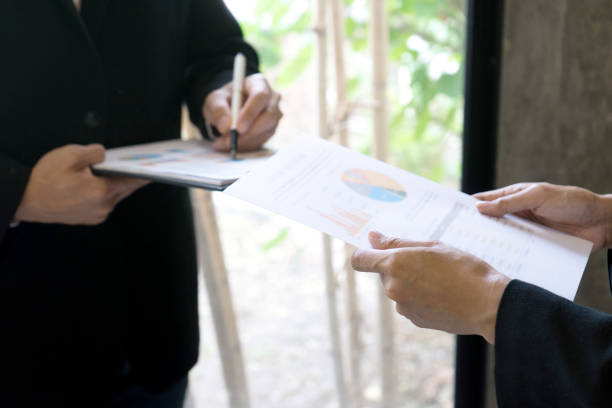 istock two businessman talk and discuss about business work 1166305834