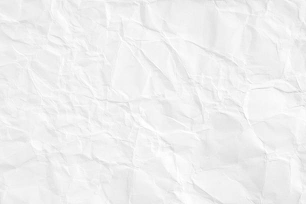 istock Closeup white crumpled sheet of paper texture background. 1166306262