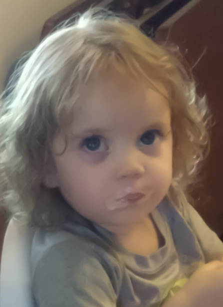 Toddler eating an ice cream cone