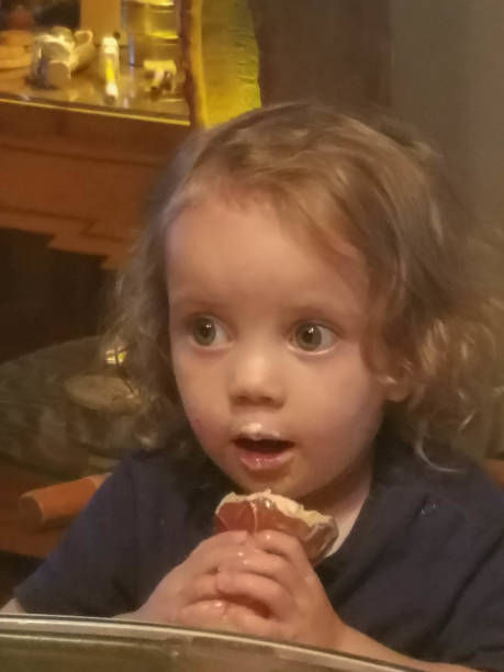istock Toddler before and while eating an ice cream cone 1166307104
