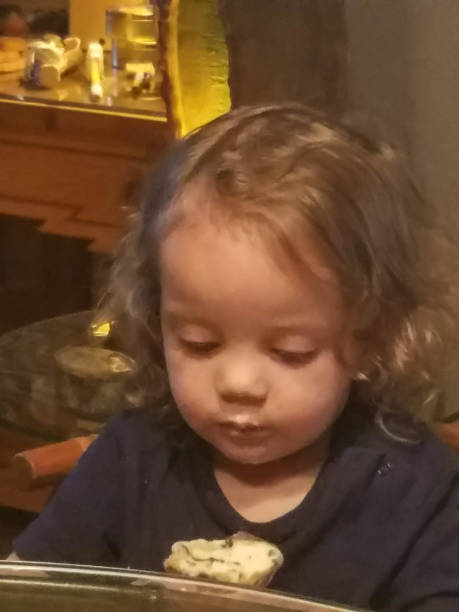 Toddler before and while eating an ice cream cone